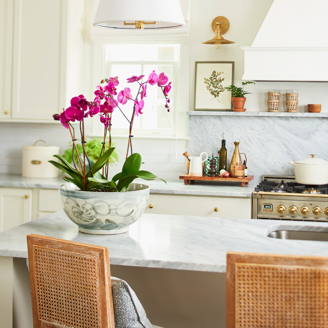 Twisted Flower Bowl styled with pink orchids in marble kitchen - Dear Keaton